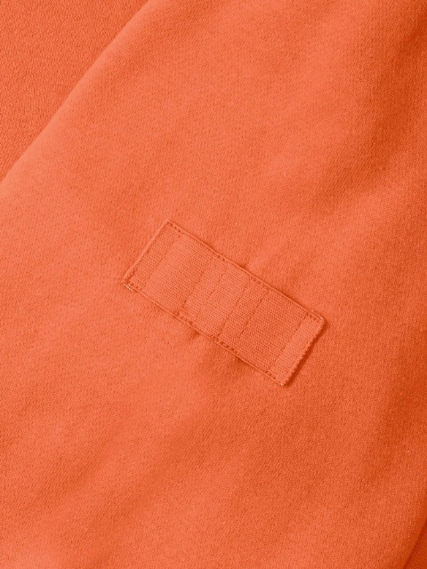 Orange (elastischer Stifthalter am Oberarm) Foto: RUSSELL-EUROPE�